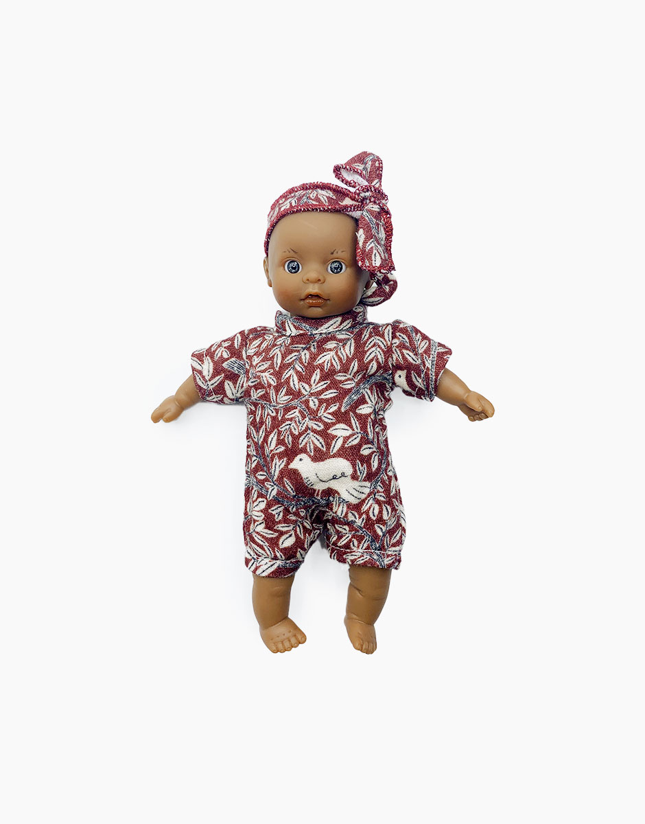Mini poupée Pia aux yeux clairs en body et headband Colombe